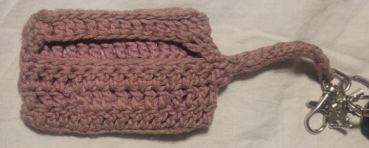 The back of the crochet keychain holder. It includes an opening for the keycard barcode
